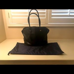 Cole Haan tote with protective dust cover.